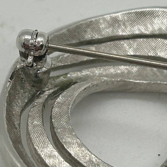 Vintage Monet Silver-Tone Brooch With Etched Textured Finish & Abstract Ribbon - Picture 8 of 13